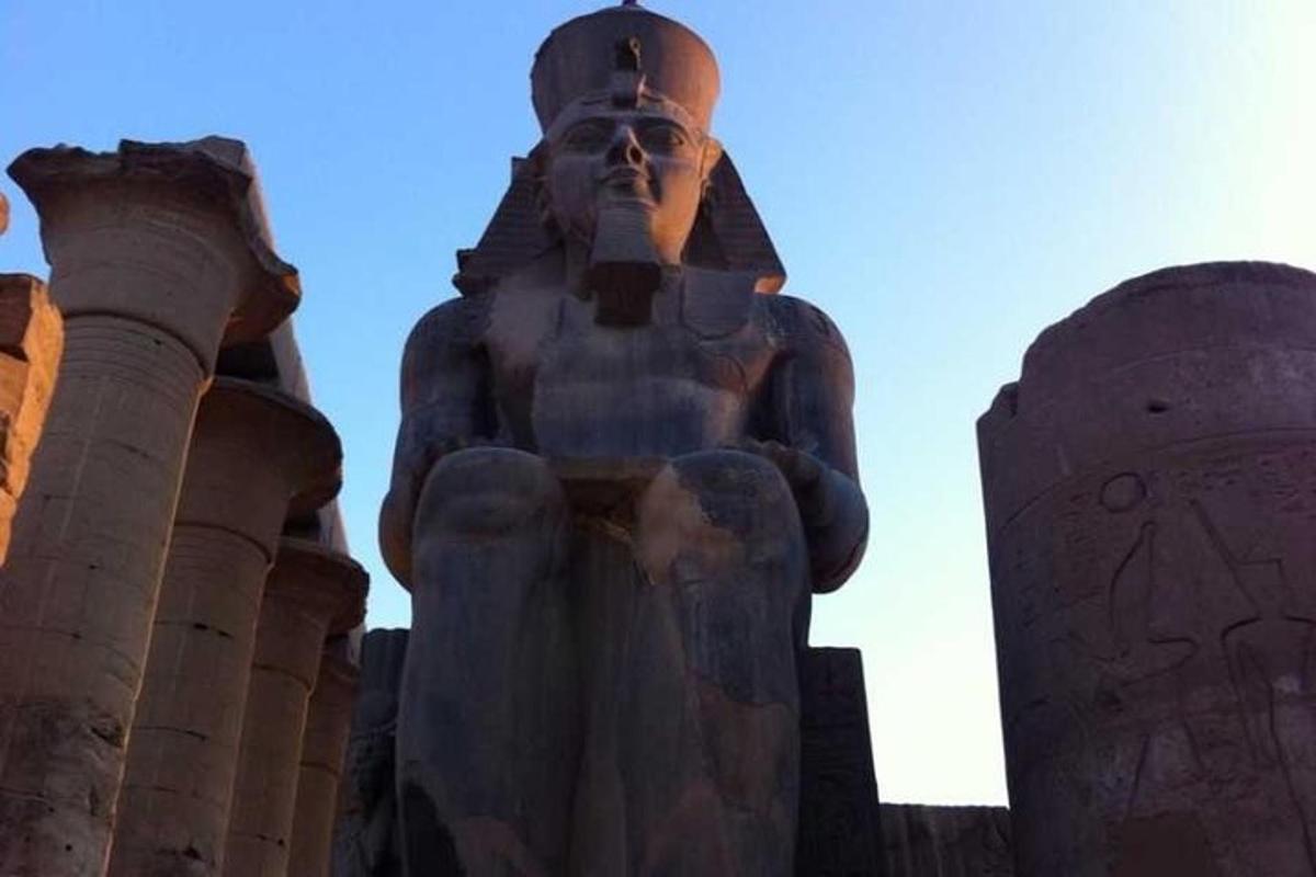 a large statue of a man standing in front ofisks