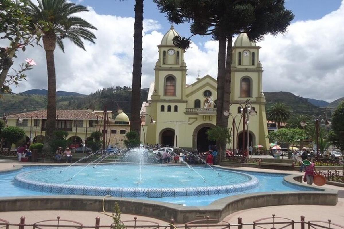 a building with a fountain in front of a church