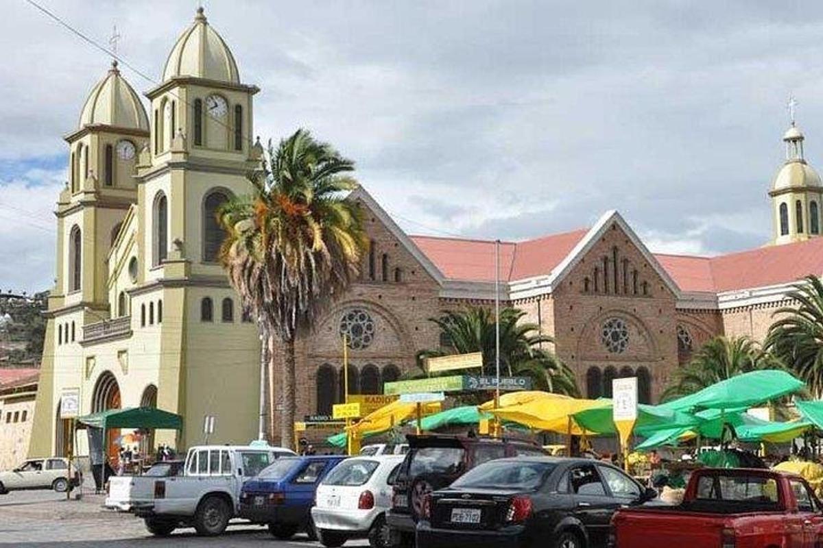 a church with cars parked in front of a building