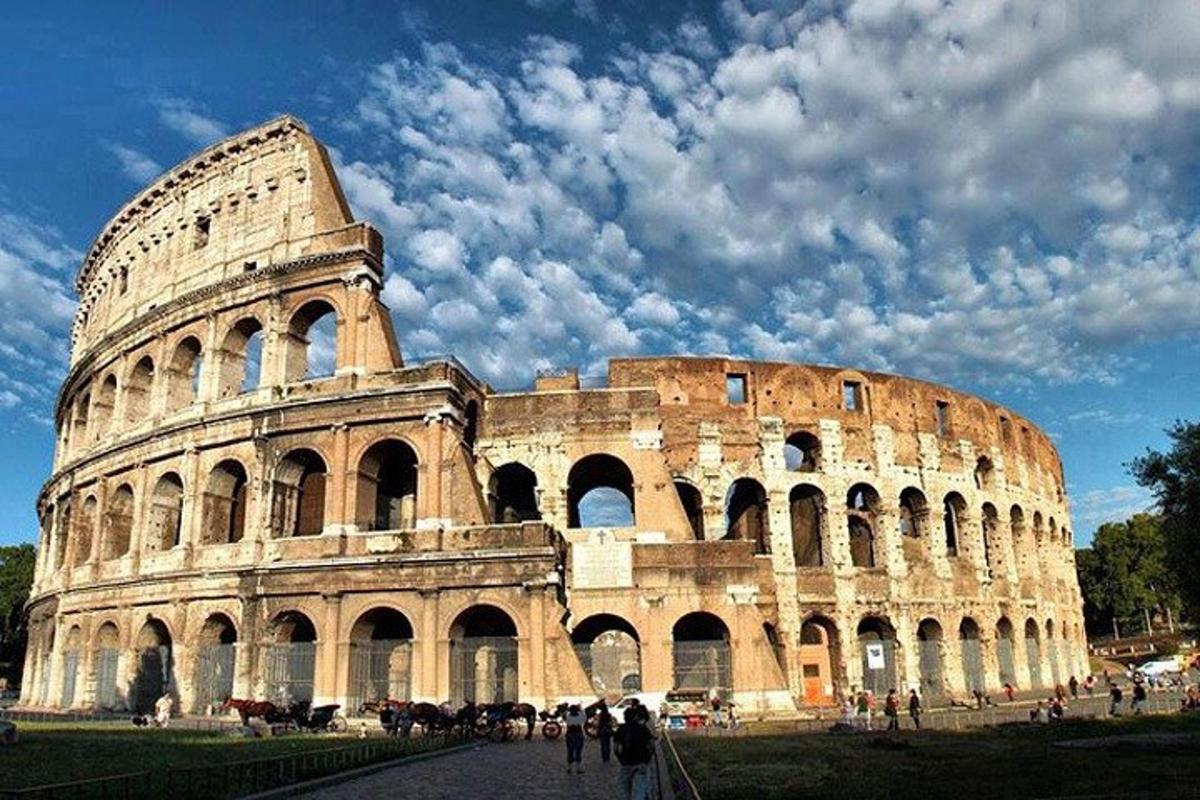 a large building with people standing in front of it