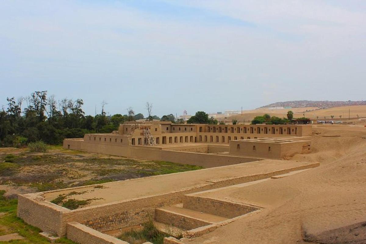 a building in the middle of a dirt field