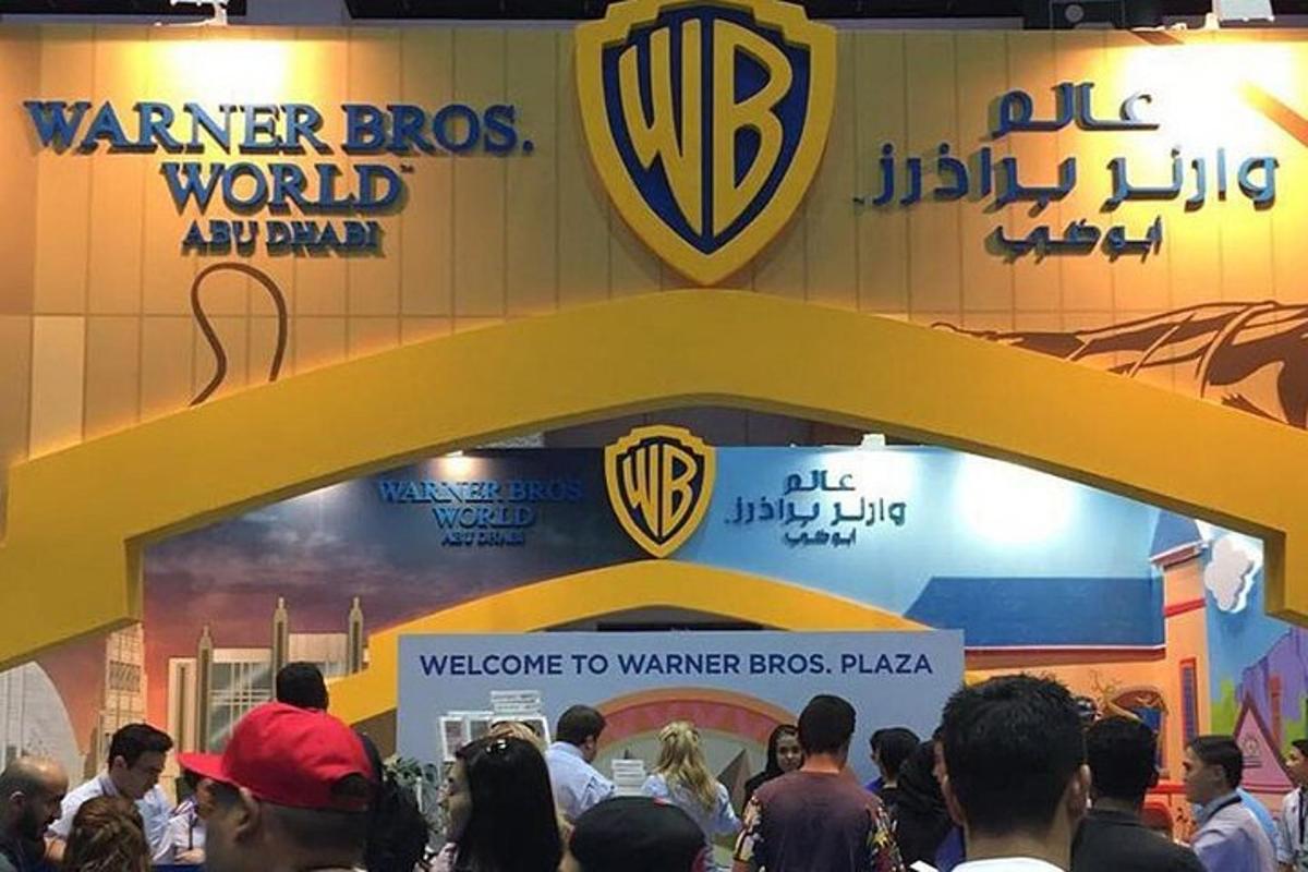 a crowd of people standing in front of a wcar bros world exhibit