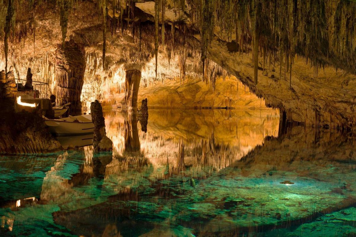 a boat in the water in a cave