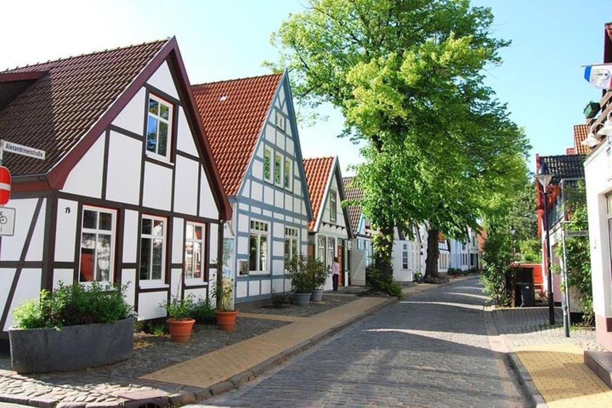 a street in a town with white and blue houses