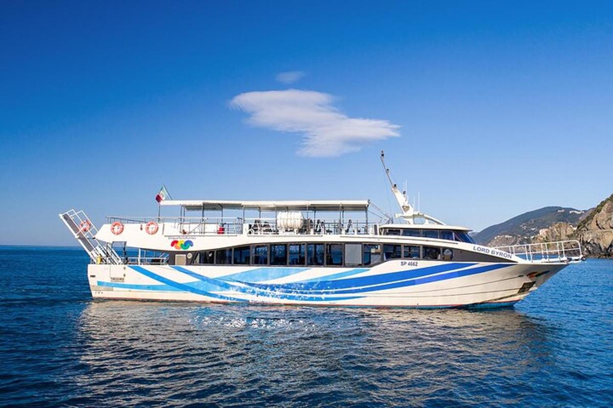 a white and blue boat in the water