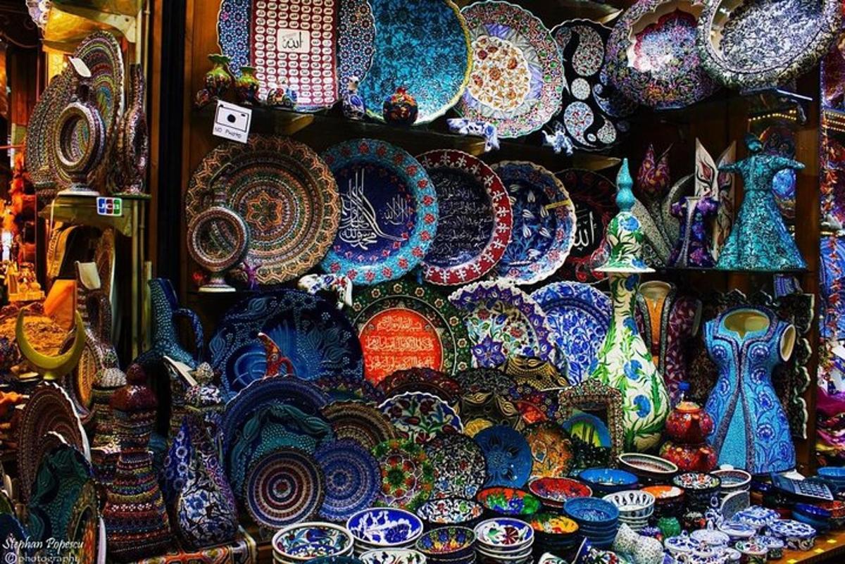 a display of colorful plates and vases in a store