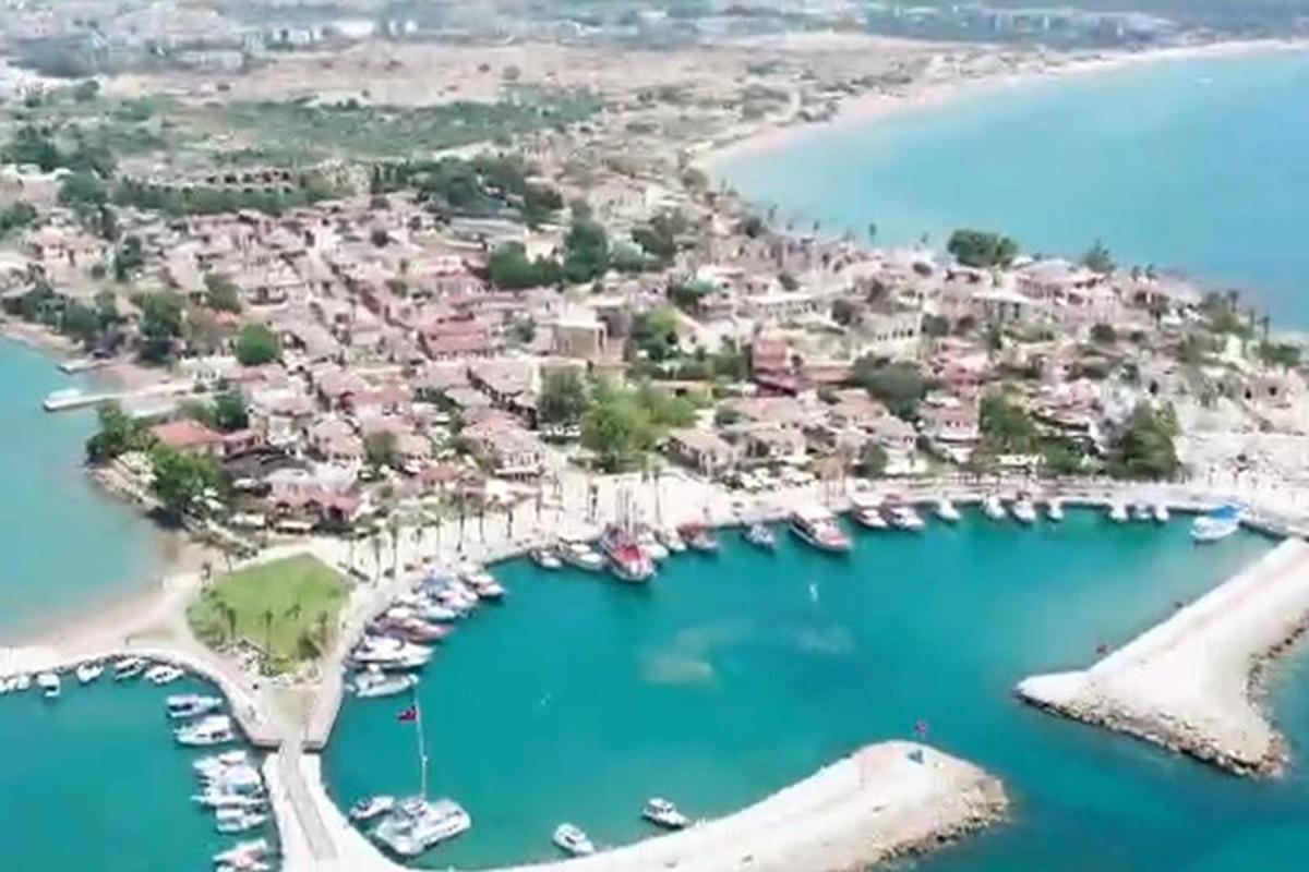 an aerial view of a harbor with boats in the water