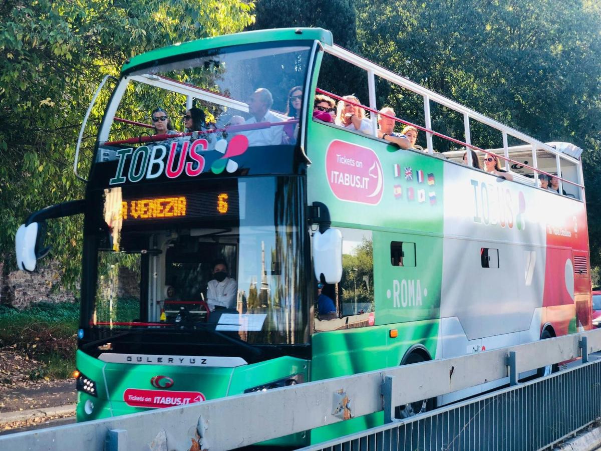 a double decker bus driving down the road