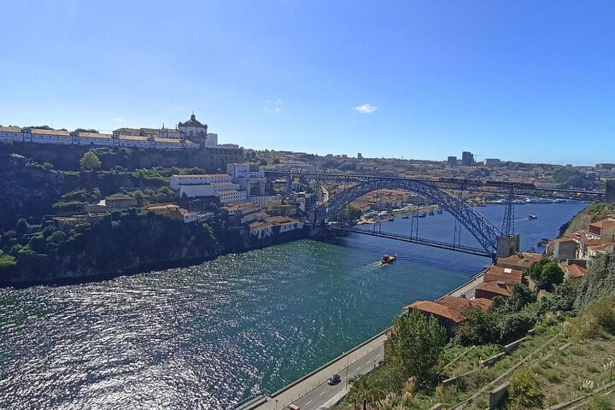 a bridge over a river next to a city