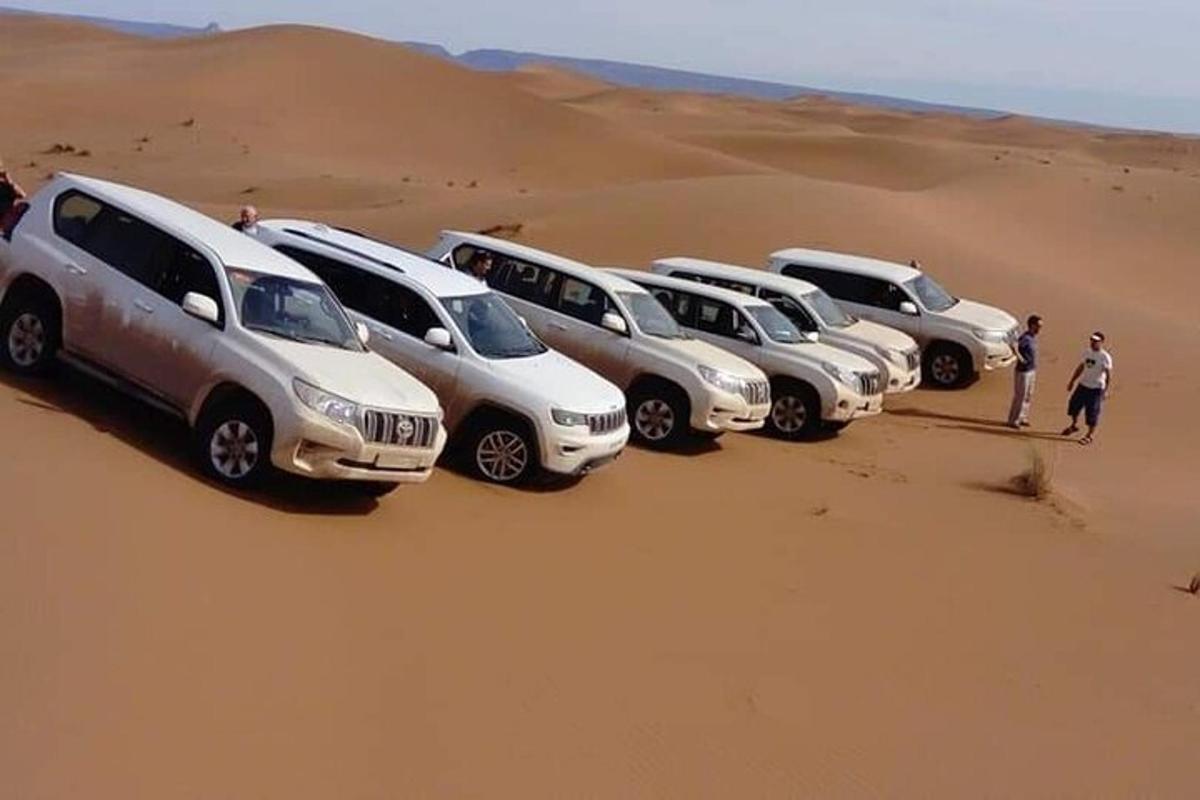 a row of cars parked in the desert