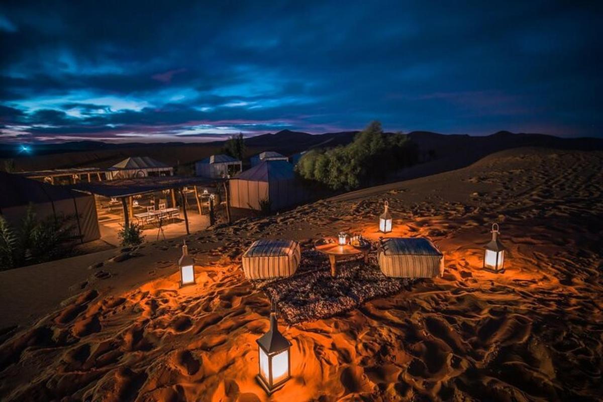 a group of tables in the desert at night