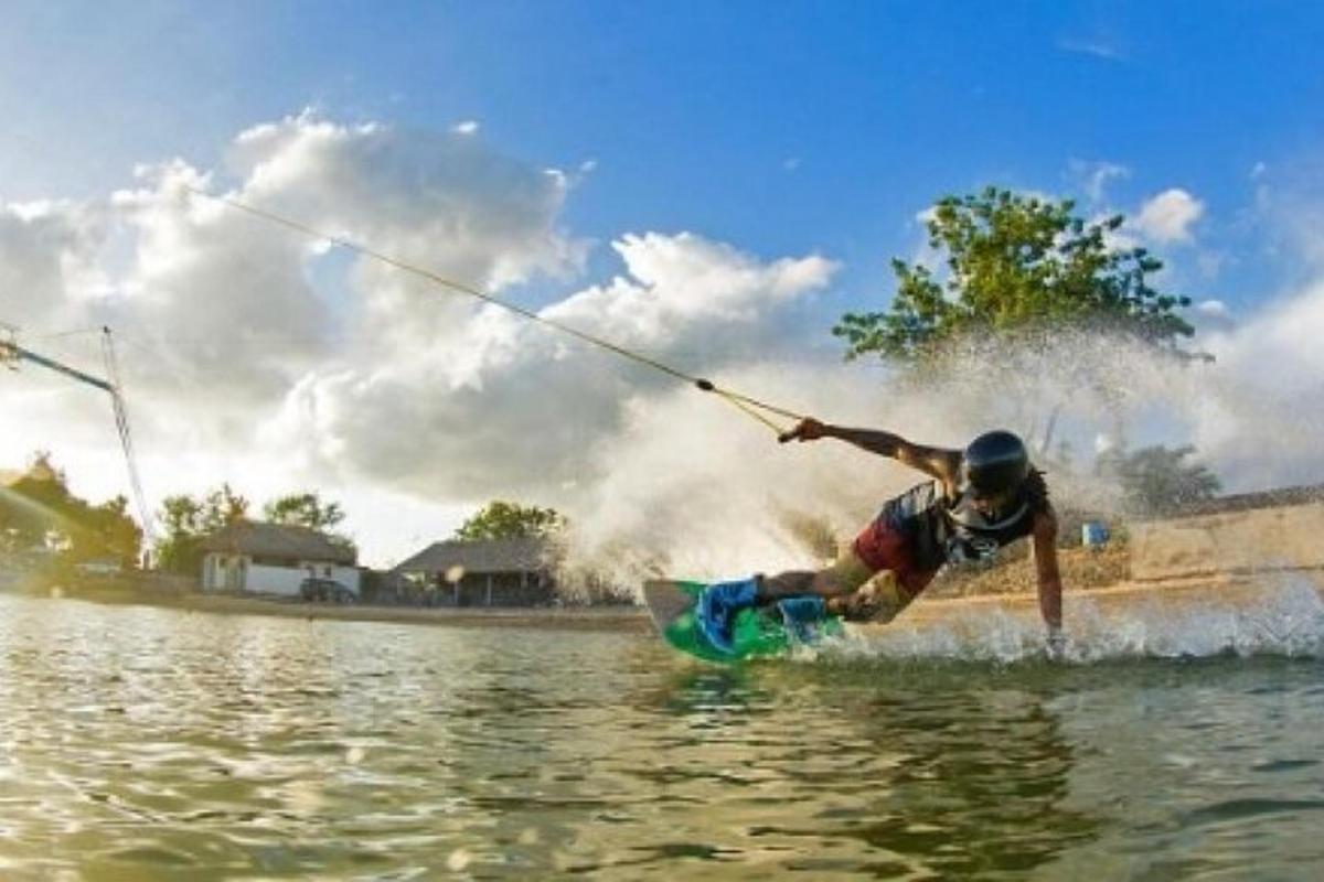 a man on a surfboard in the water
