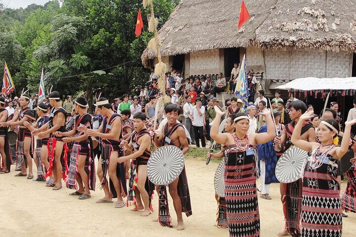 a group of people dressed in traditional dances in front of a crowd