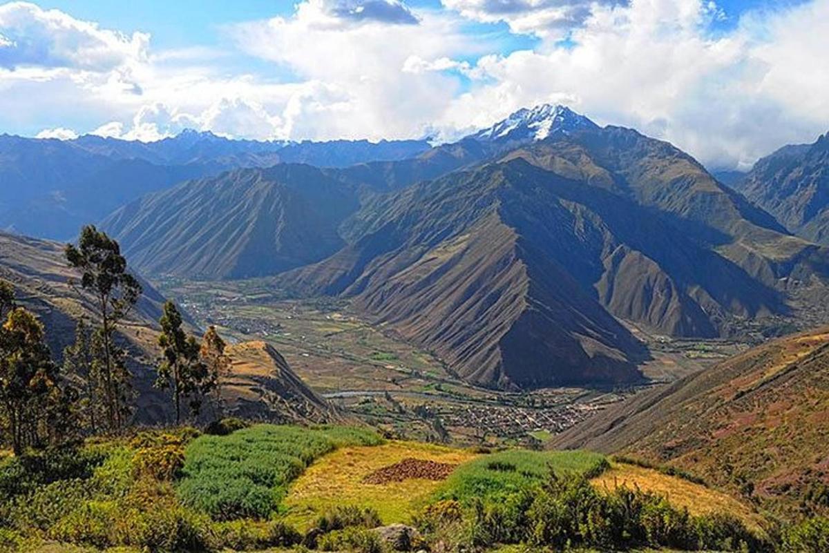 a view of a mountain valley with mountains