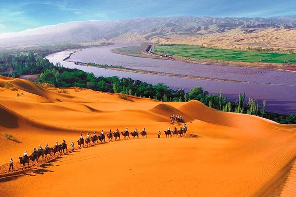 a group of people riding horses in the desert