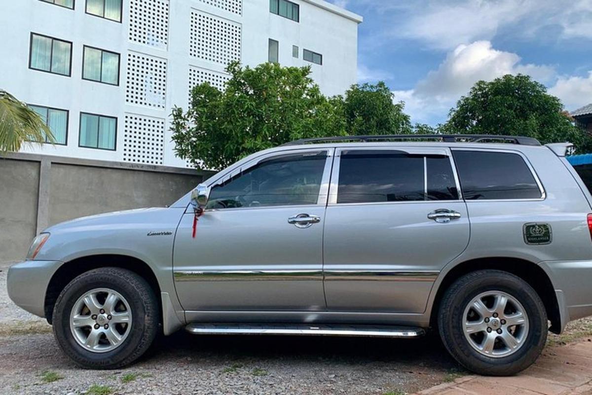 a silver suv parked in front of a building