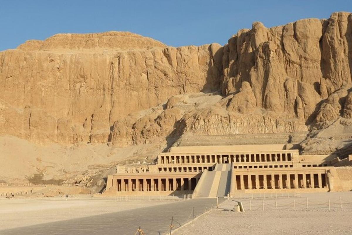 a building in the desert near a mountain