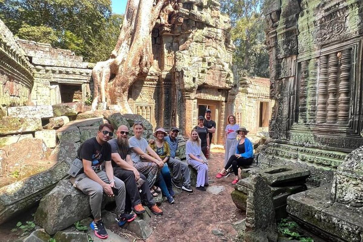 a group of people posing for a picture in a temple