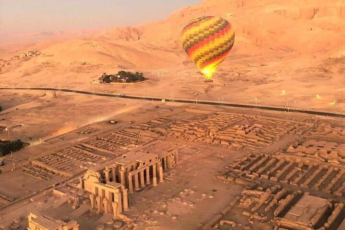 a hot air balloon flying over an ancient city
