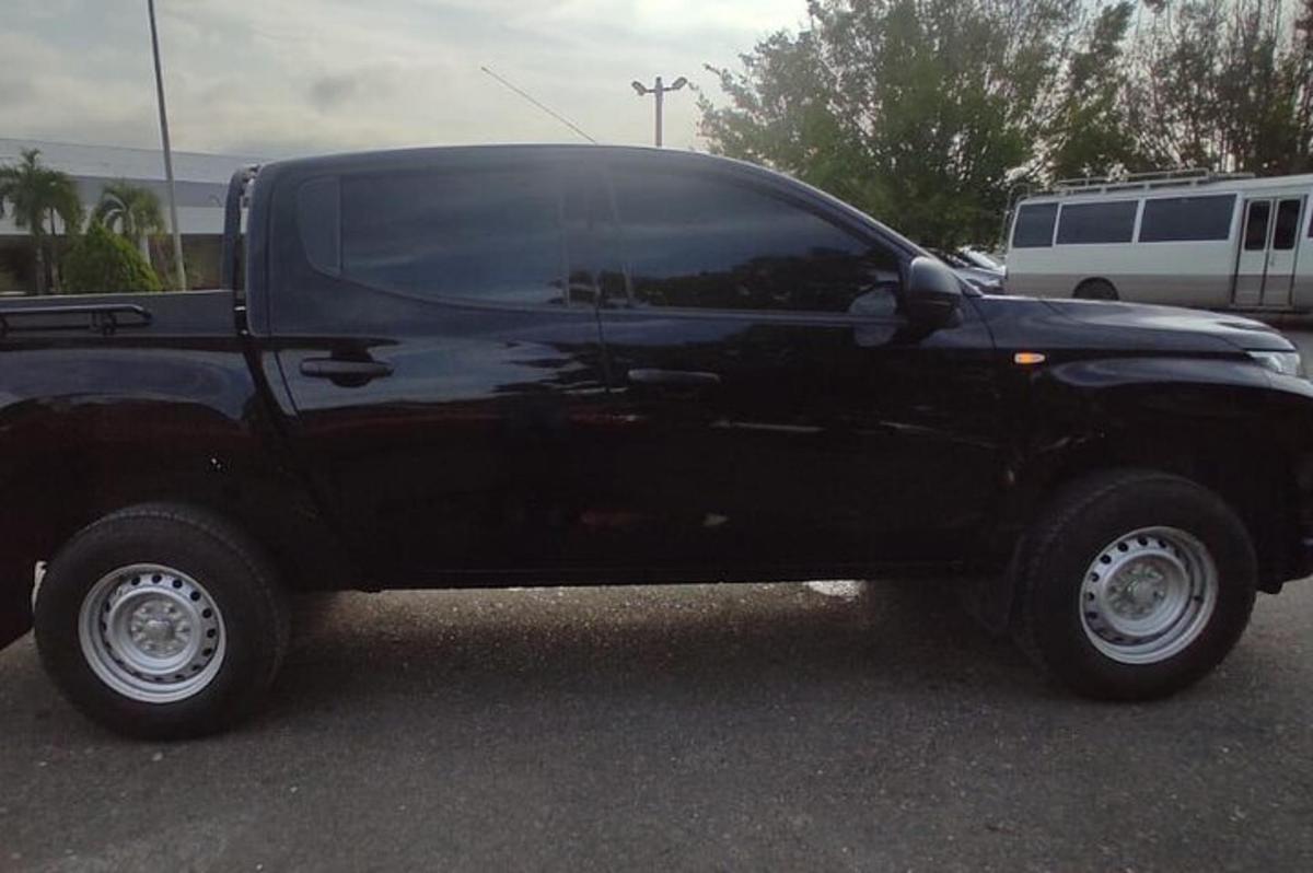 a black truck parked in a parking lot