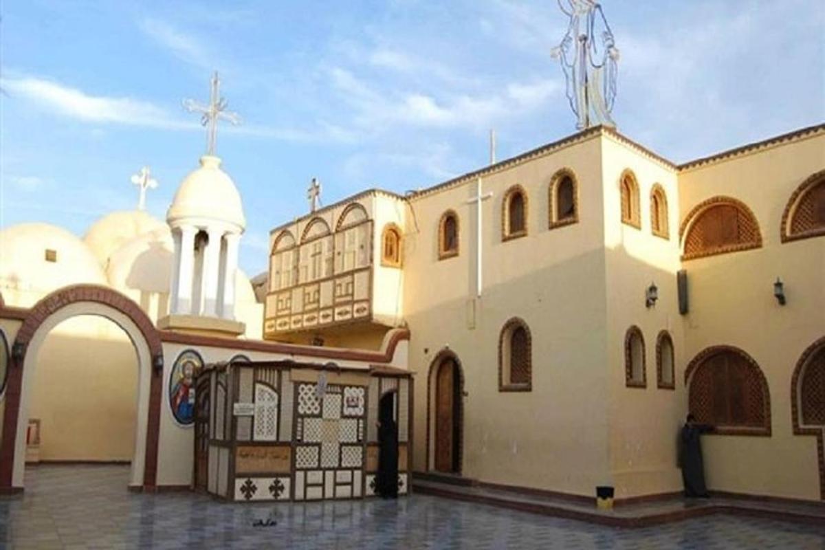 a church with a cross on the top of it