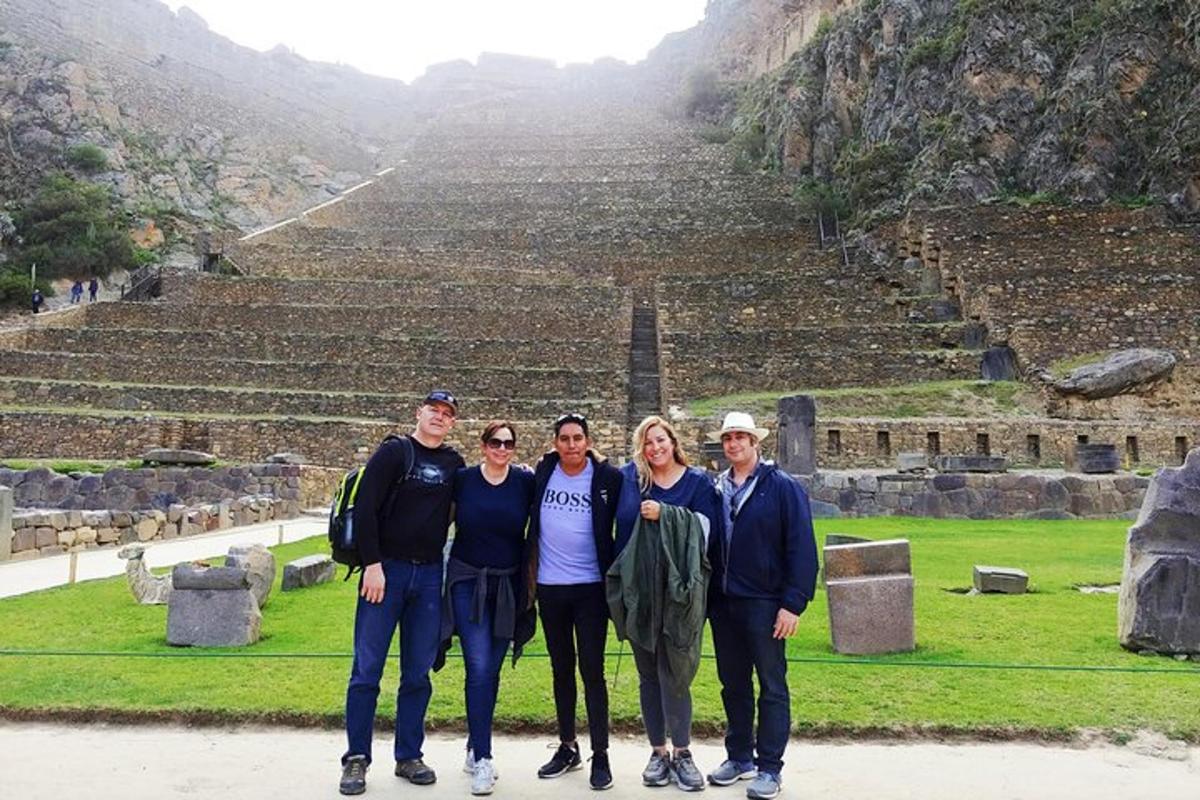 a group of people standing in front of an amphitheater