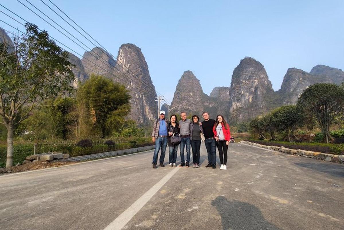 a group of people standing in the middle of a road