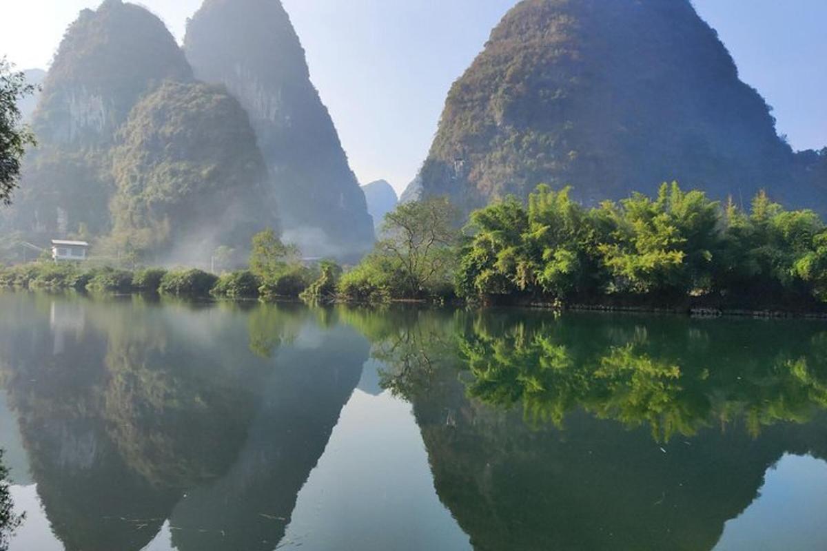 a view of a river with mountains in the background
