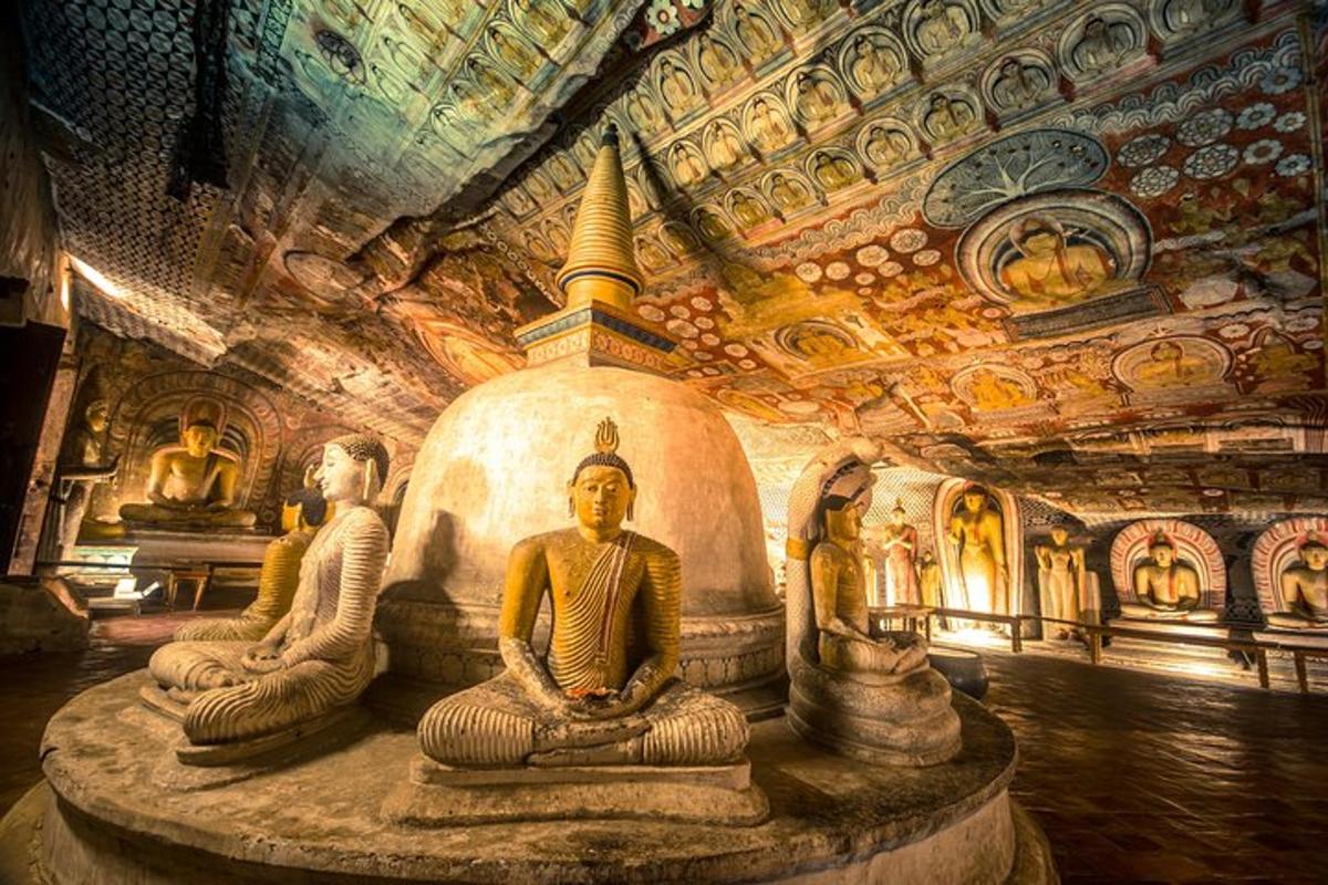 a group of statues in a room with a ceiling