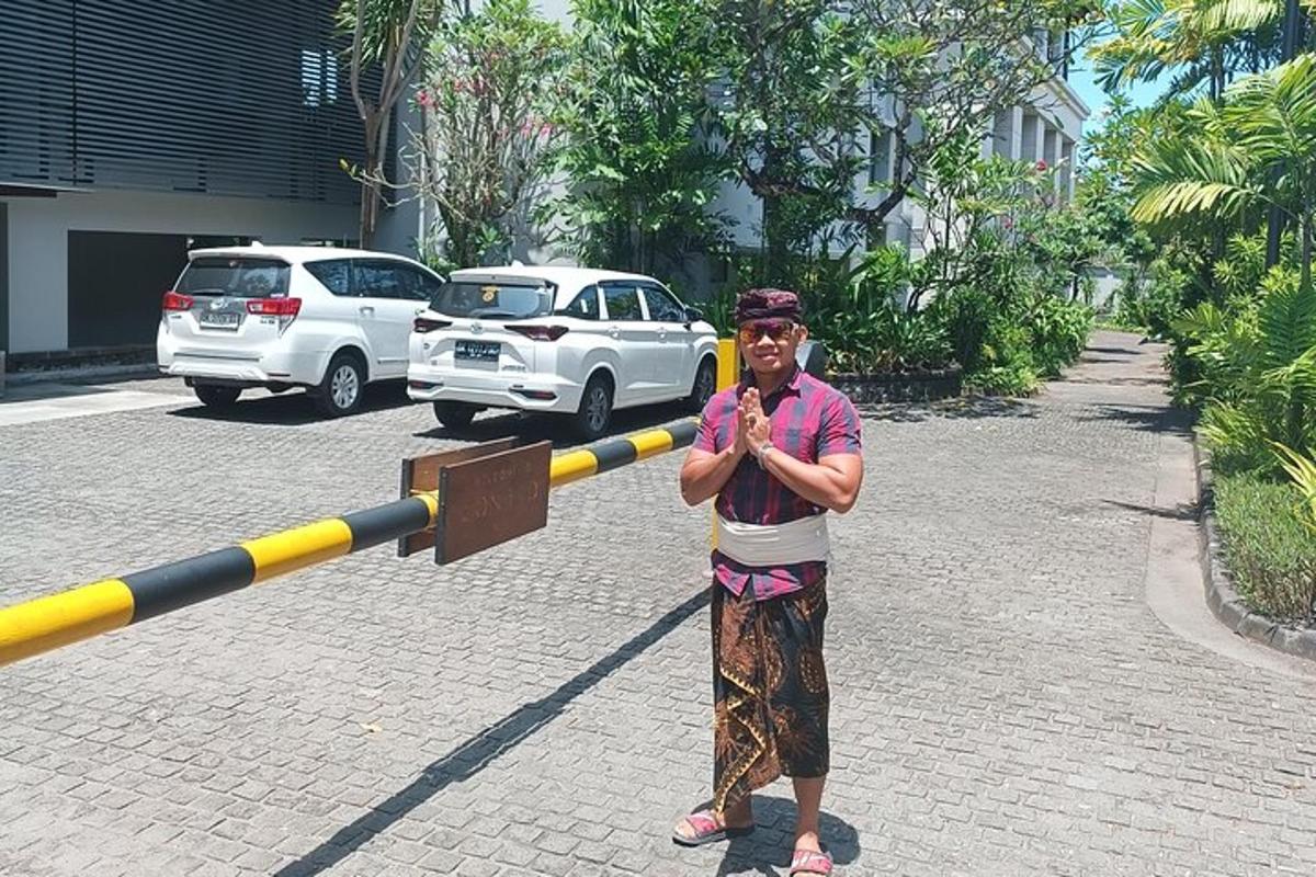 a man is standing in front of a large pole