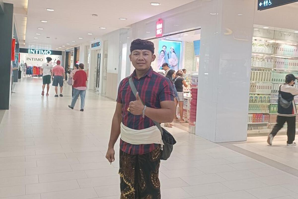 a man is standing in a shopping mall