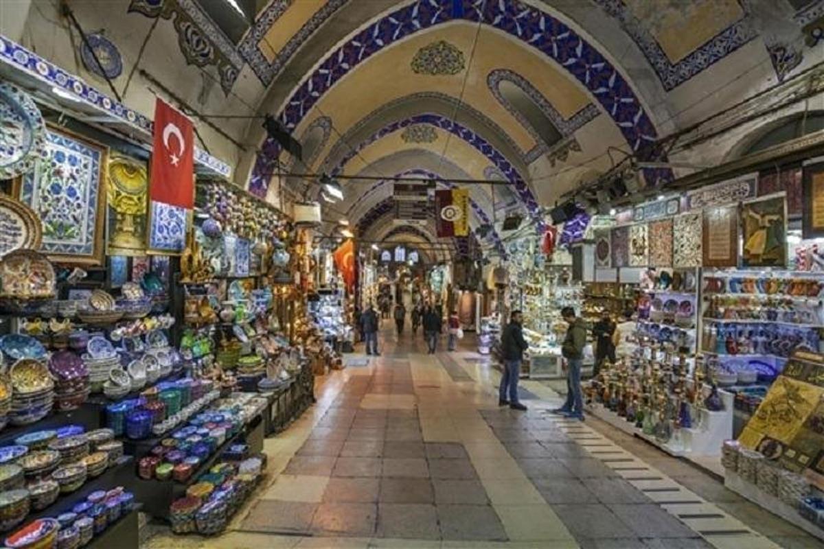 a view of a market with people walking through it
