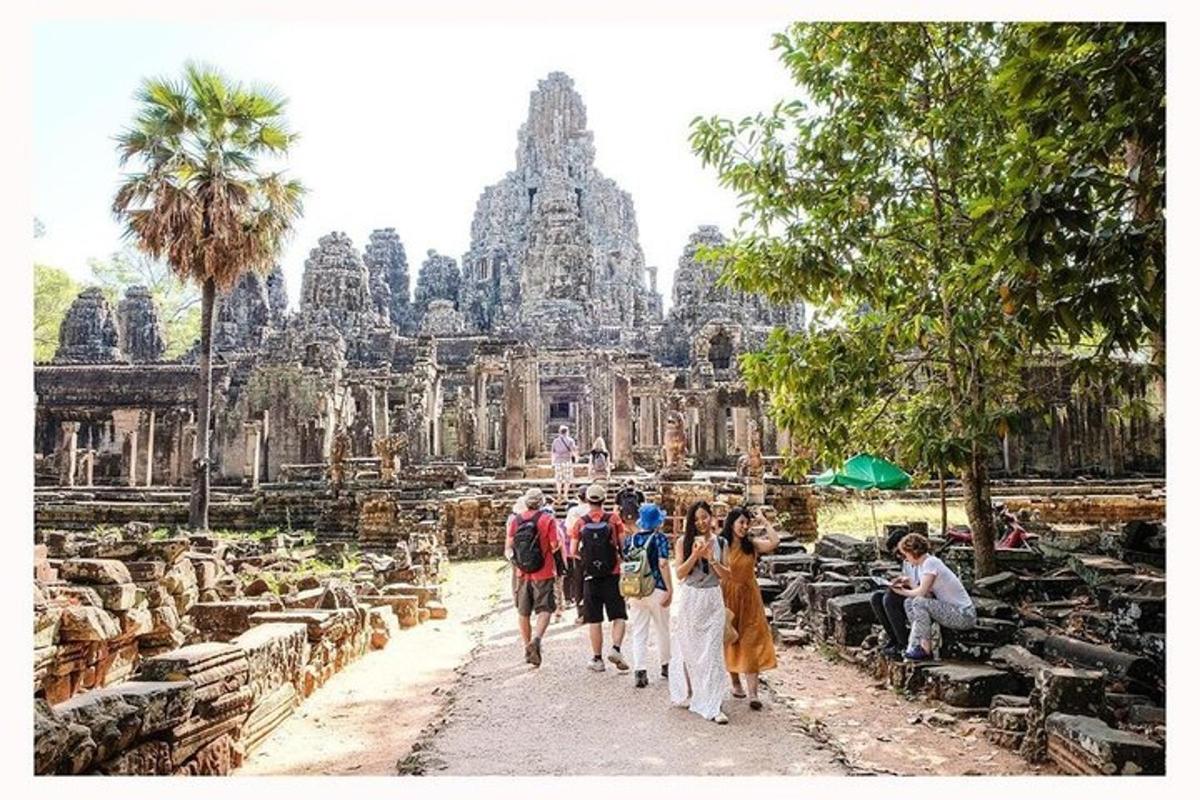 a group of people walking in front of a temple