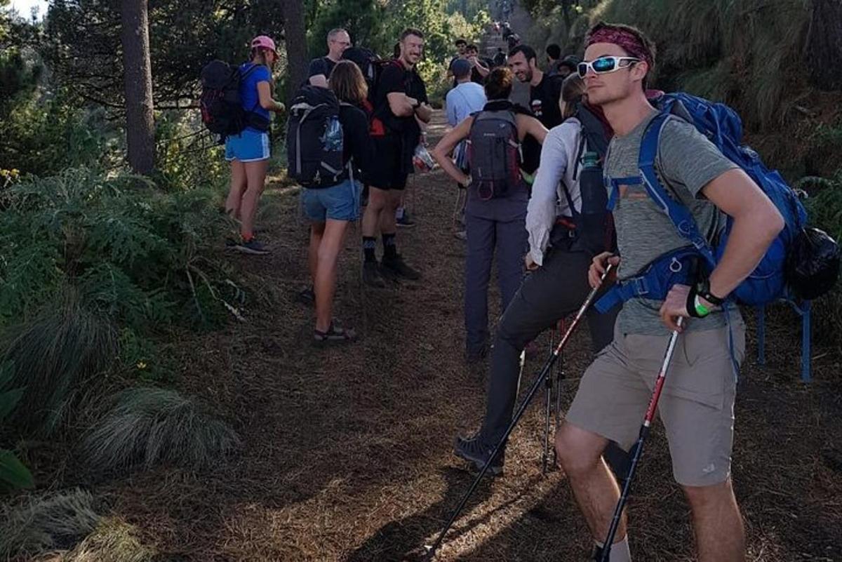 a group of people walking on a trail