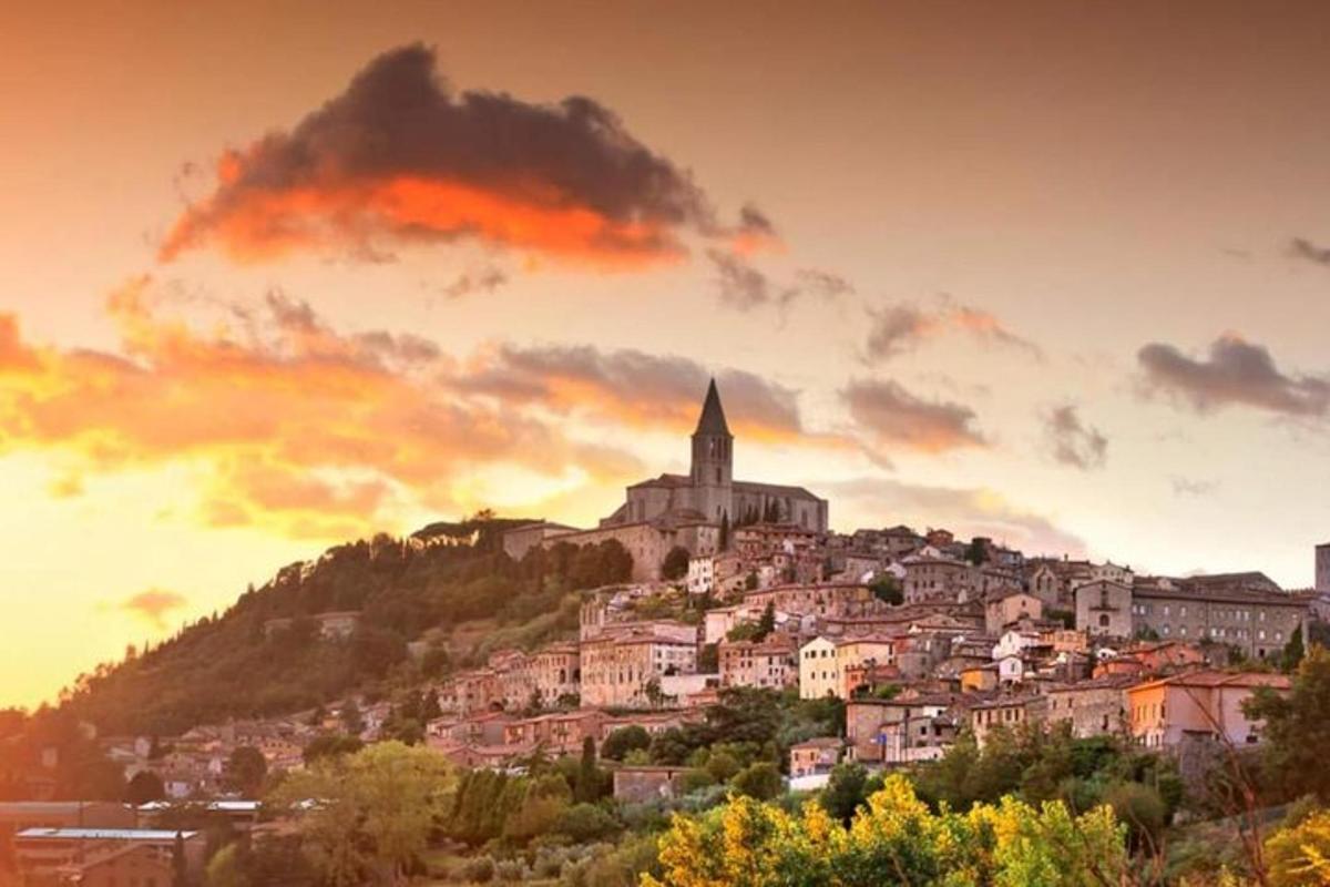 a town on top of a hill with a church