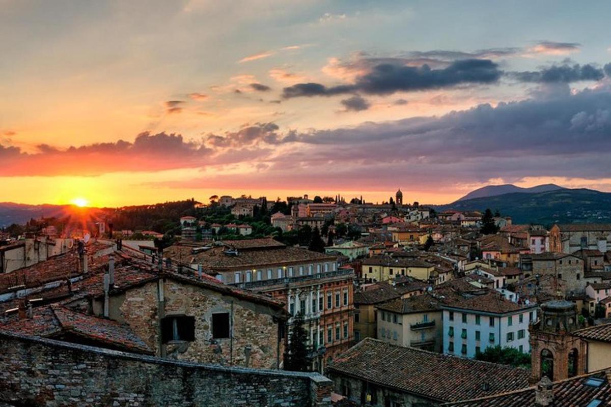 a view of a city with the sun setting