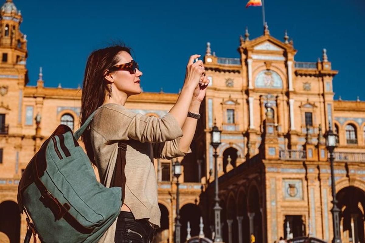 a woman taking a picture of a building
