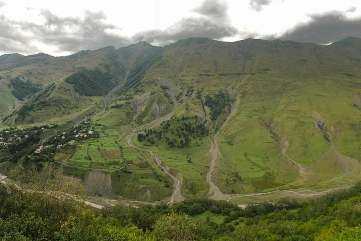 an aerial view of a valley in a mountain