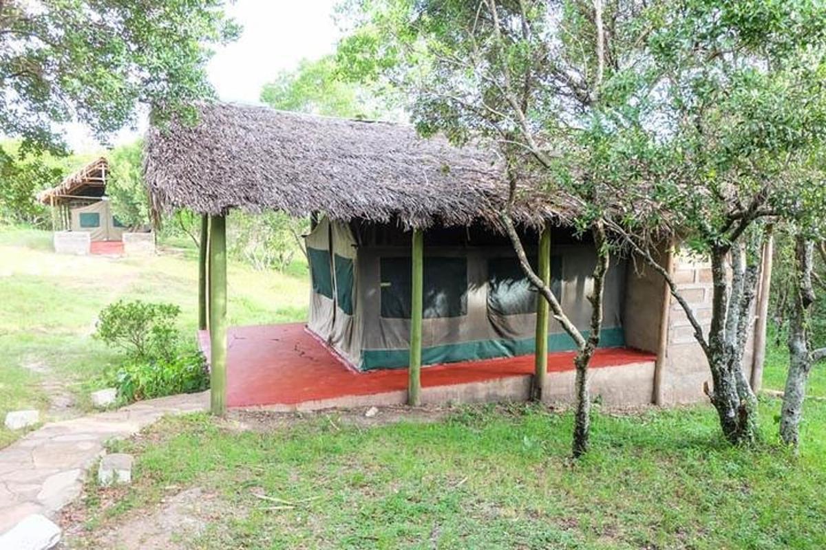 a small house with a thatch roof