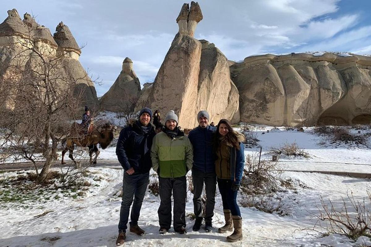 a group of people posing for a picture in the snow