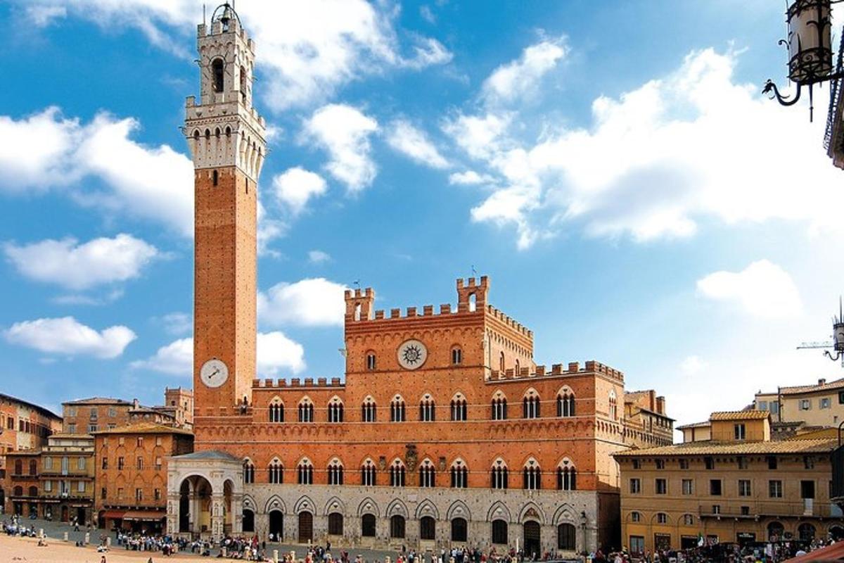a large building with a clock tower in front of it