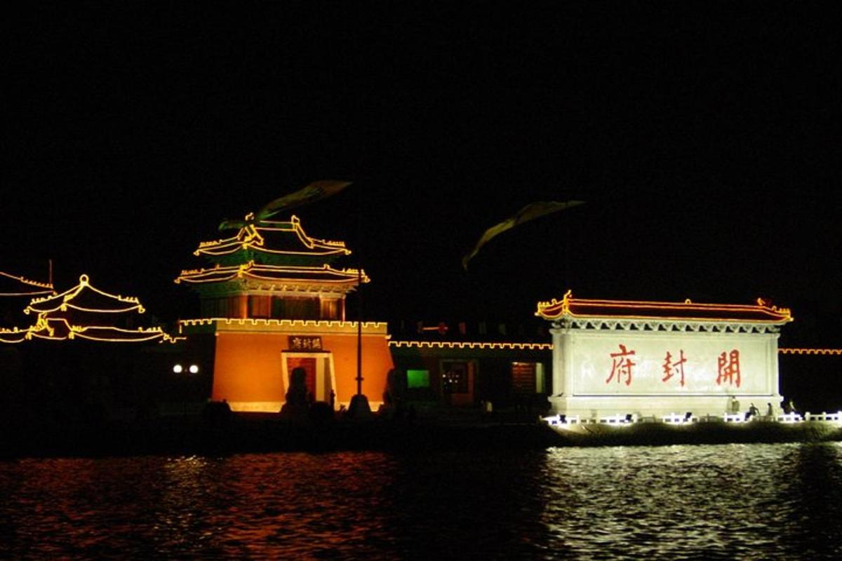 two buildings with chinese writing on them at night