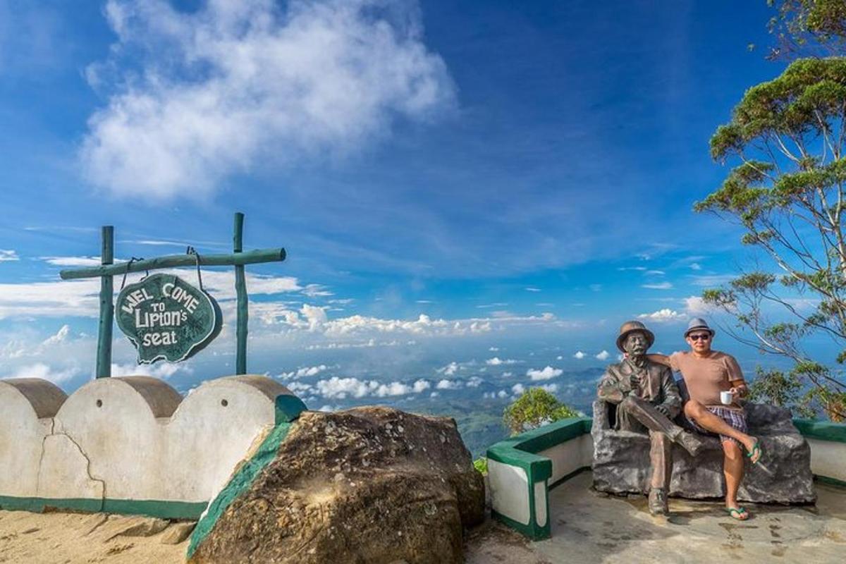 two people sitting on a rock in front of a sign