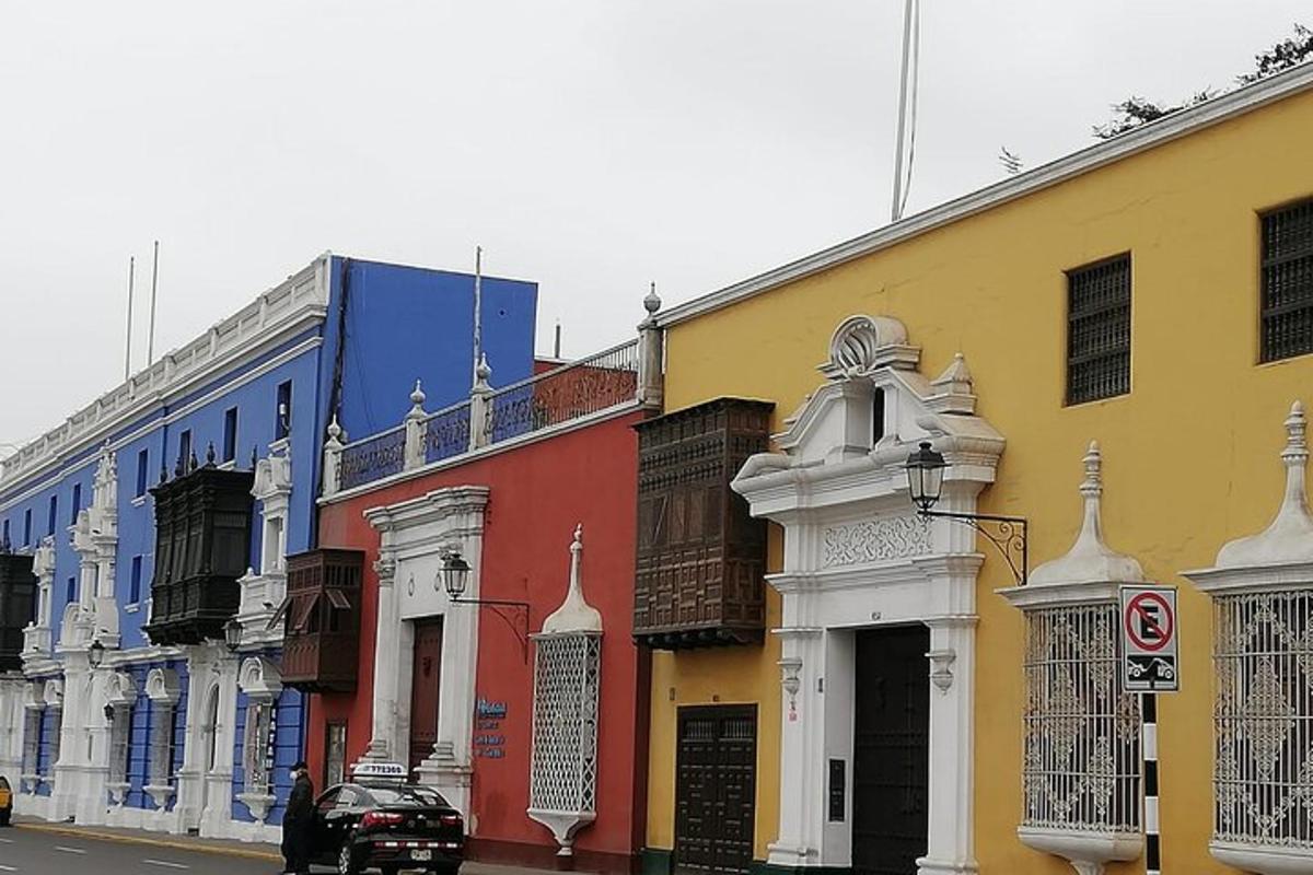 a row of brightly colored buildings on a street