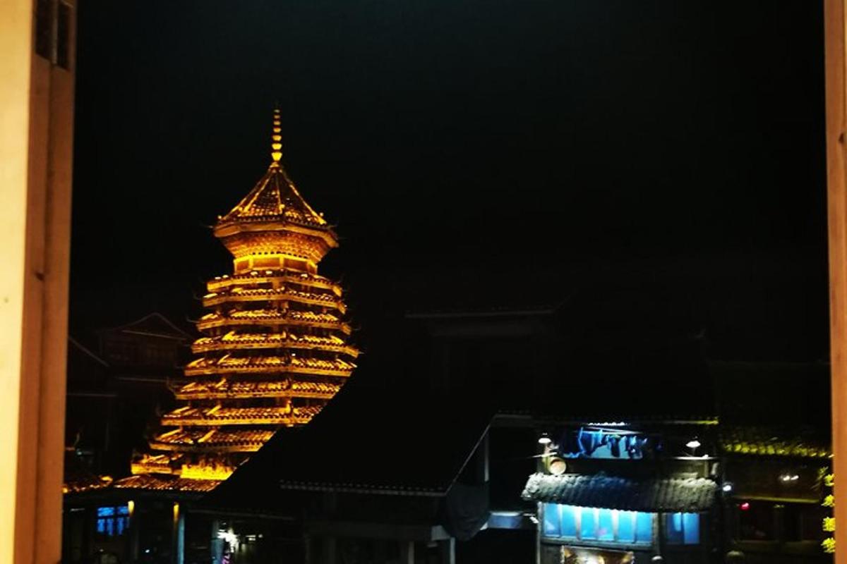 a large building with a tower at night