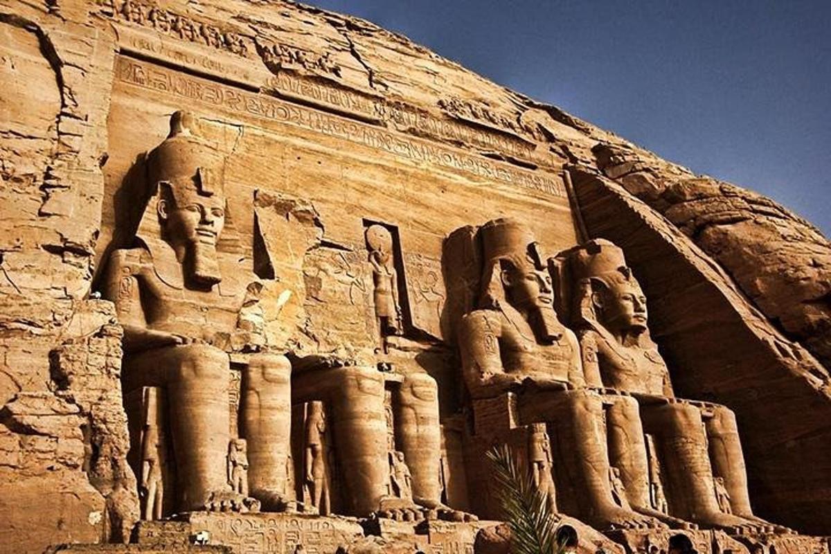 a stone building with statues on the side of it