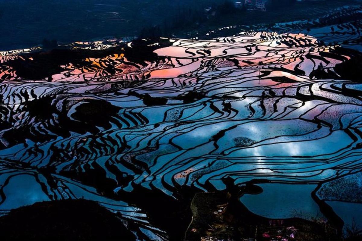an aerial view of a river at night