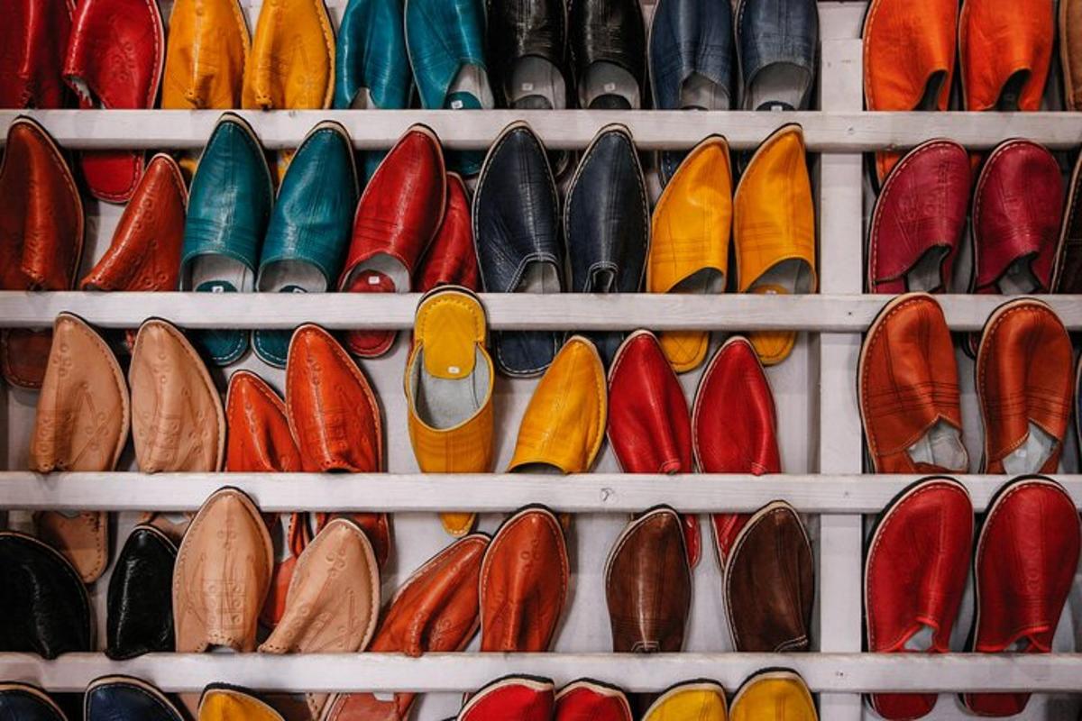 a bunch of different types of shoes on shelves