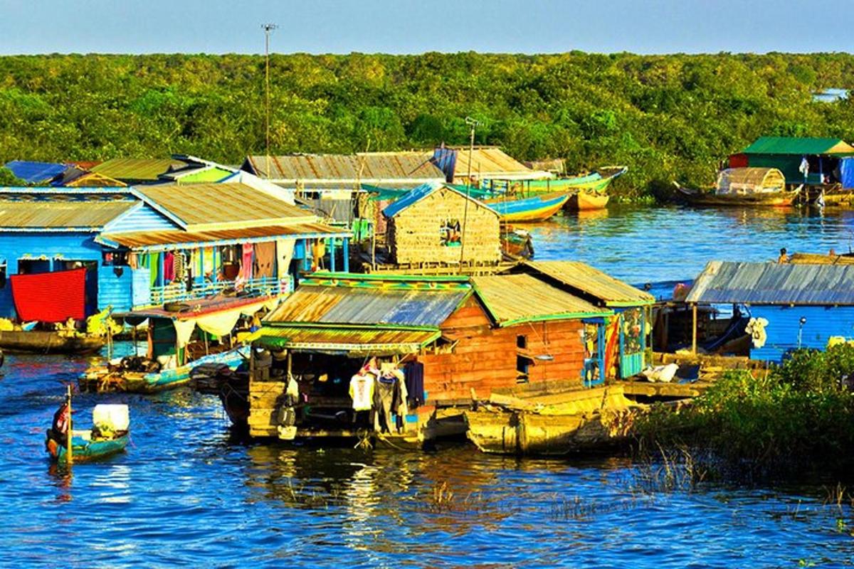 a group of houses and boats on a body of water