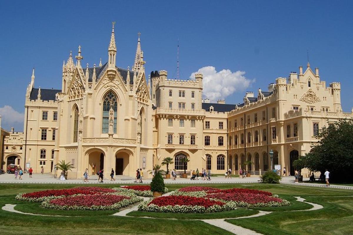 a large building with a garden in front of it
